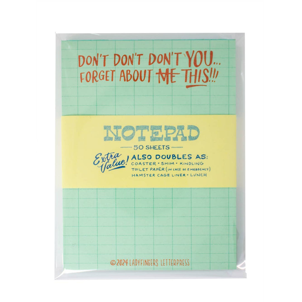Notepad with light green background with light blue grid and red text at top of pad says, "Don't don't don't you...forget about this!!!". 