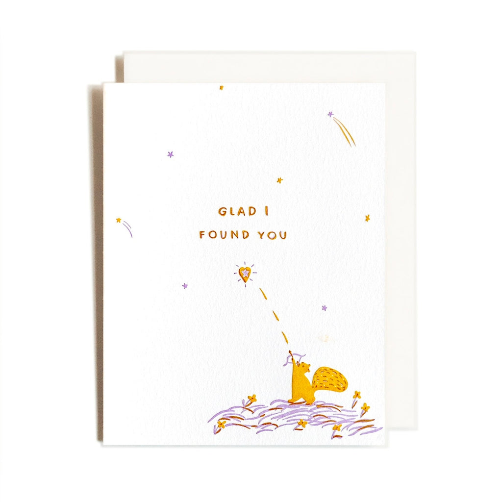 greeting card with a squirrel shooting an arrow at a heart. Text says "glad I found you"