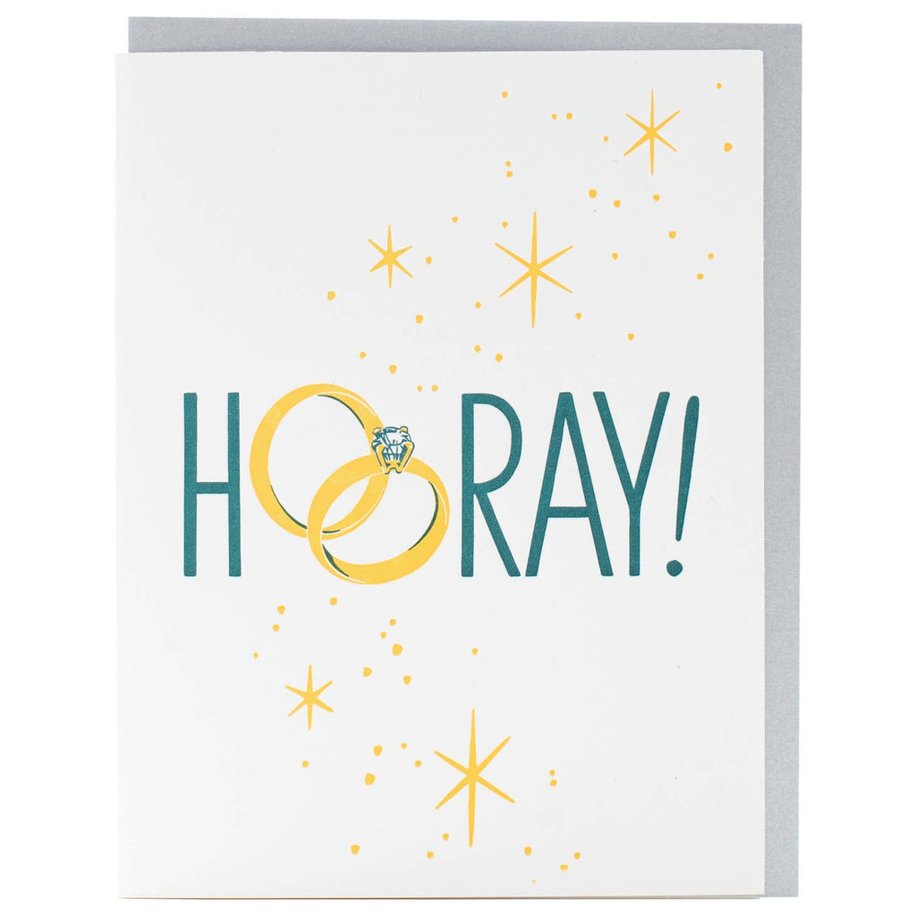 White background with green text says, "Hooray!" with wedding and engagement rings as the "OO". Yellow sparkles and a grey envelope is included.