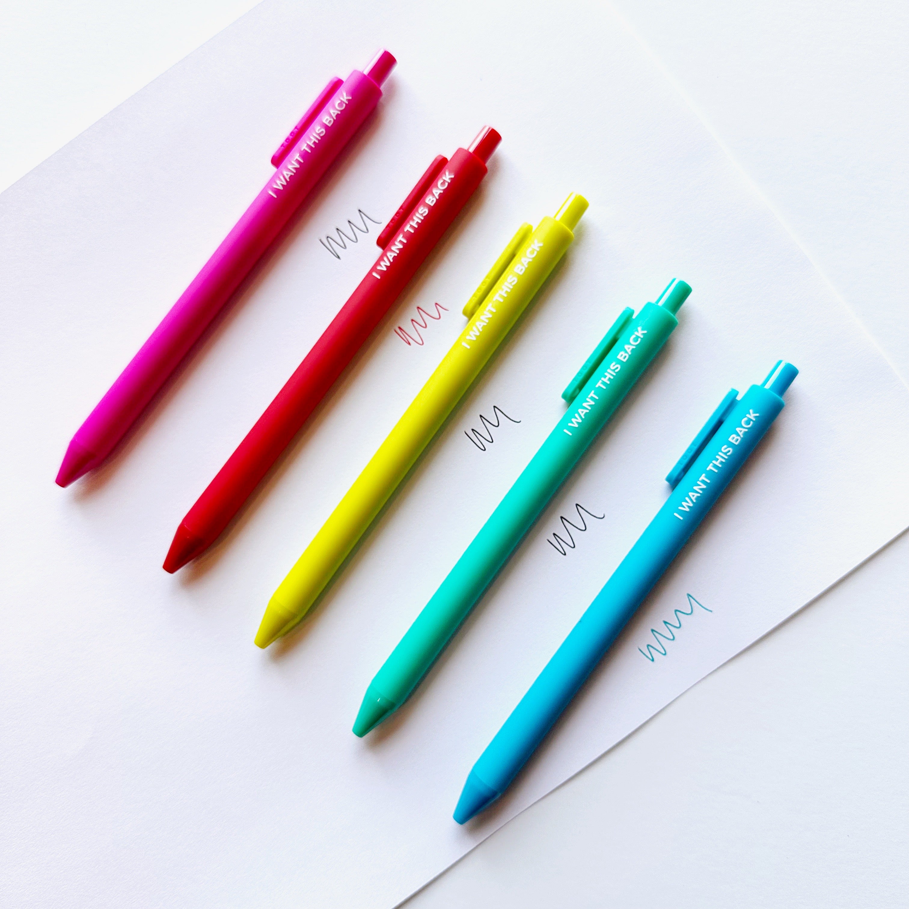 Image of five pens in pink, red, citron, aqua, and blue with white text says, "I want this back".