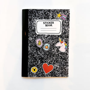 Image of black and white composition notebook as a sticker book with images of stickers on the front including a unicorn, heart, smiley face, orange and bananas with black text on white field says, "Sticker book" with lines for adding name."