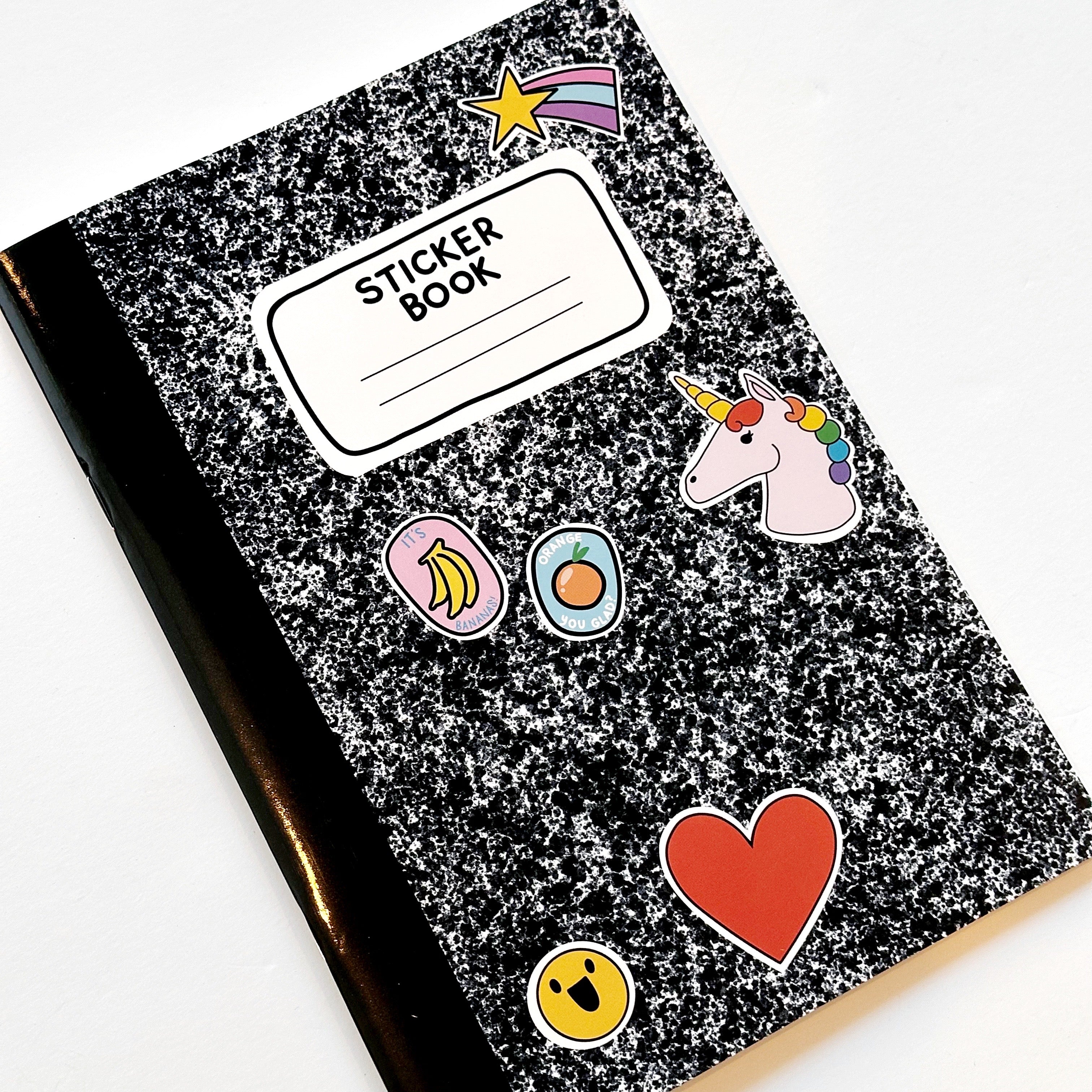 mage of black and white composition notebook as a sticker book with images of stickers on the front including a unicorn, heart, smiley face, orange and bananas with black text on white field says, "Sticker book" with lines for adding name."