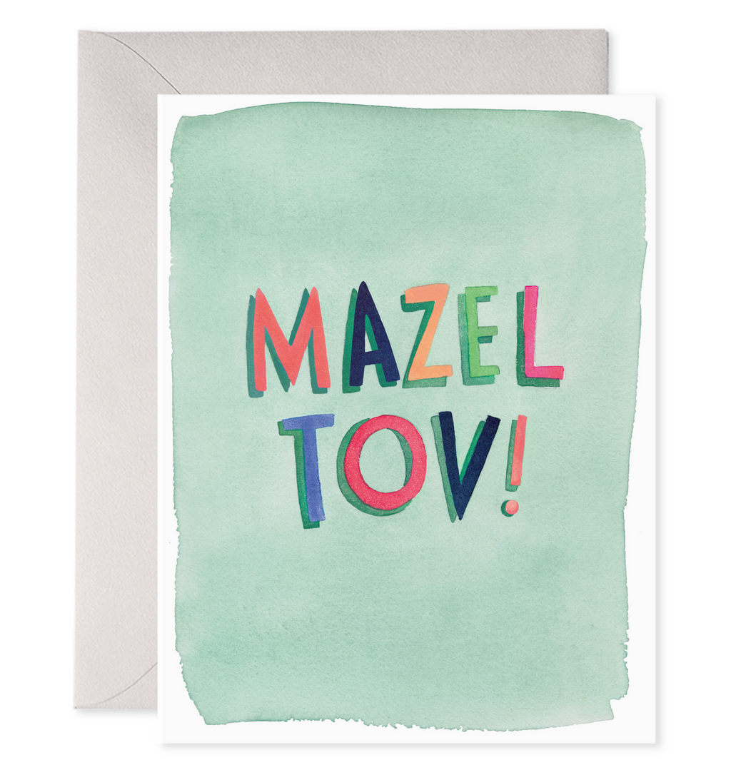 Greeting card with mint green background and text in different bright colors says, "Mazel Tov!". Grey envelope included. 