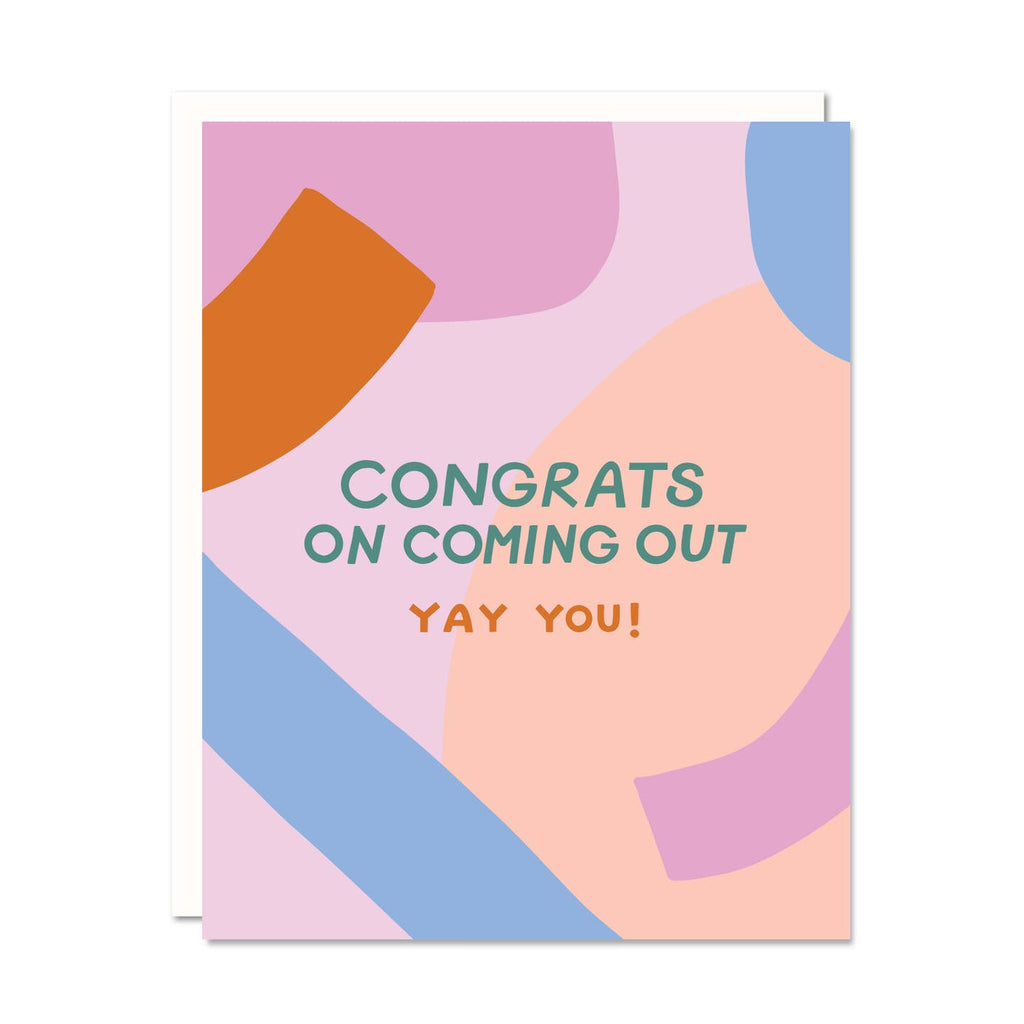 Greeting card with multicolored graphic background in pink, peach, blue and red with green texts says, "Congrats on coming out" and red text says, "Yay you!". White envelope included. 