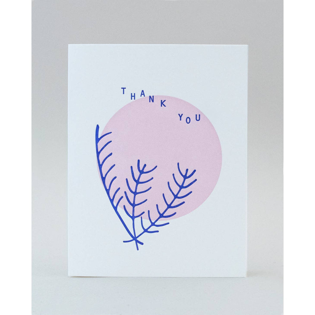 White background with image of pale pink circle and blue ferns with blue text says, "Thank you". Envelope included.
