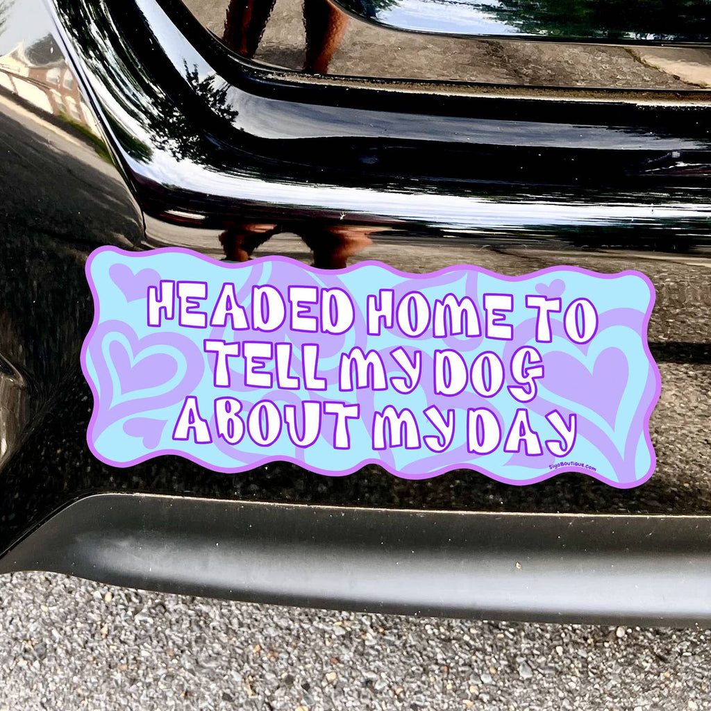 Light blue background with lilac hearts and white text says, "Headed home to tell my dog about my day". 