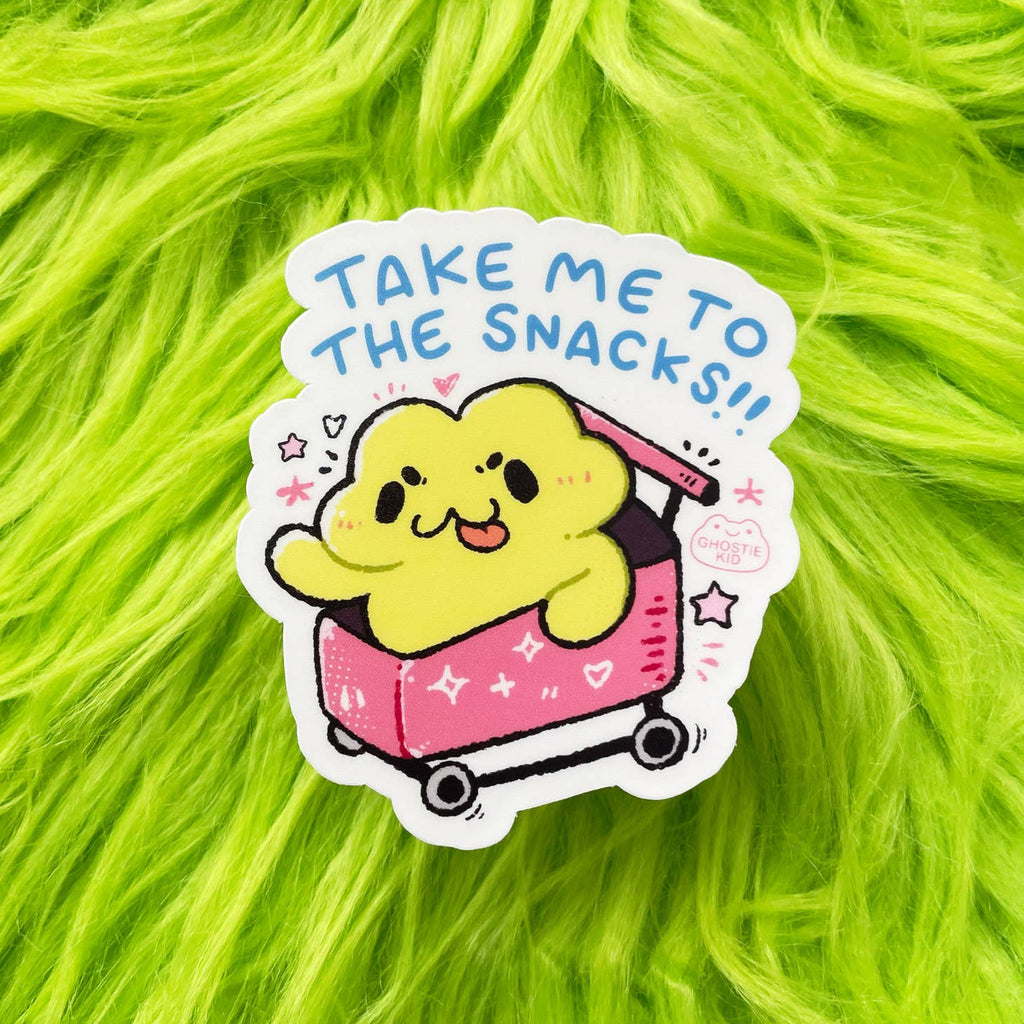 Image of sticker with white background and image of yellow frog in a pink wagon with blue text says, "Take me to the snacks!!".