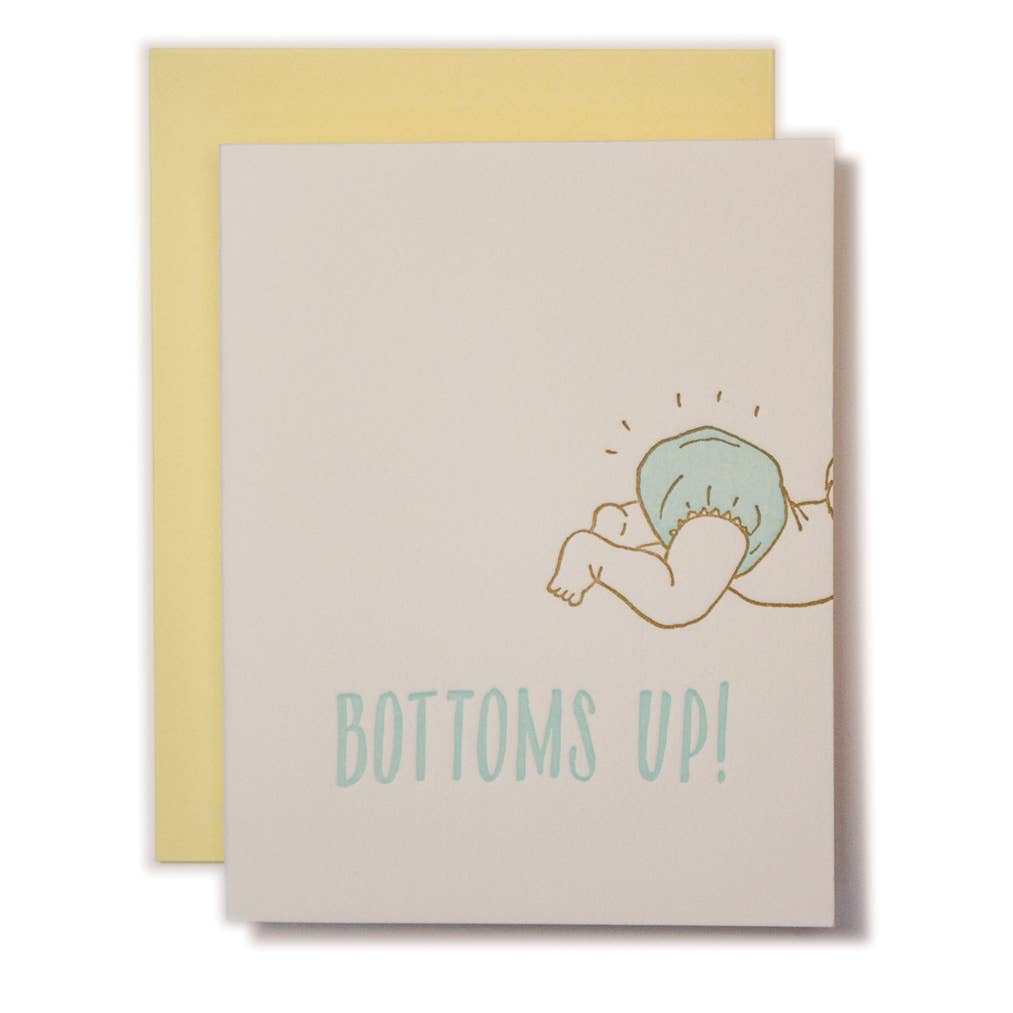 Greeting card with white background and image of a baby's diapered bottom in light aqua with aqua text says, "Bottoms Up!". Yellow envelope included.