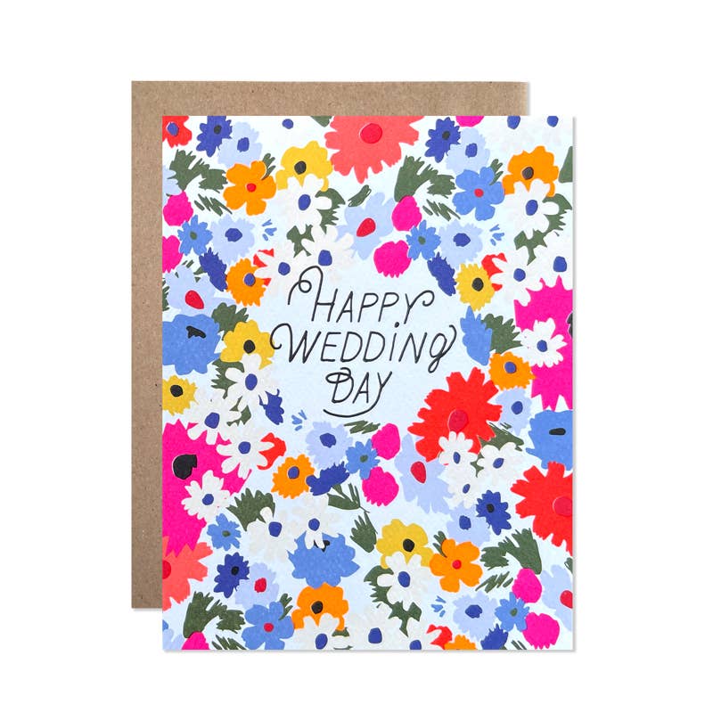 Greeting card with white background and images of multicolored flowers with green text says, "Happy Wedding Day". Kraft envelope included.