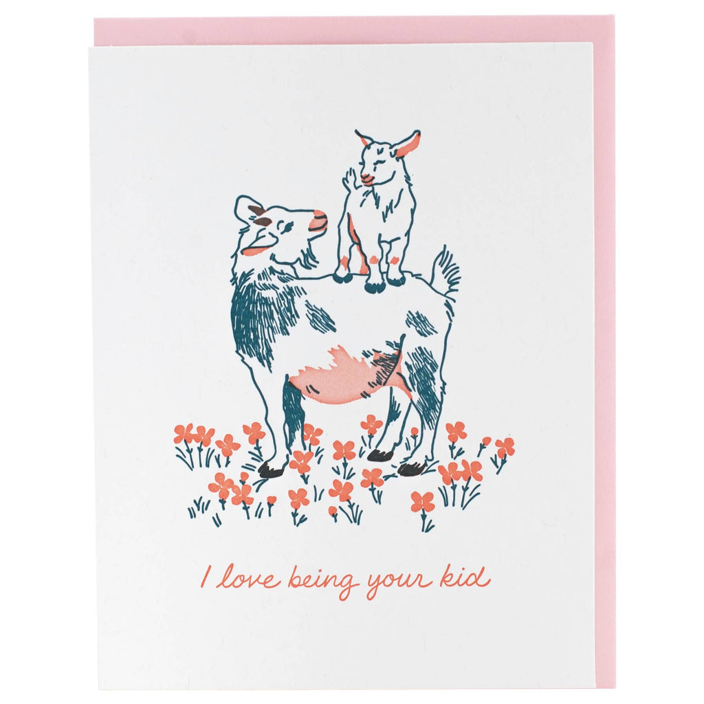 Greeting card with white background and images of a goat with a kid on its back in blue and pink. Pink text says, "I love being your kid". Pink envelope included. 