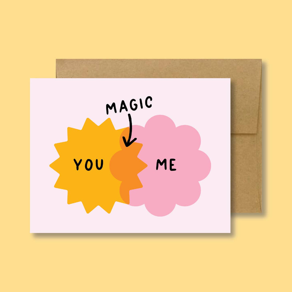 White background with bright yellow star and bright pink flower shape intersecting in orange with black text says, “You, Me, Magic” with arrow. Kraft envelope is included.   