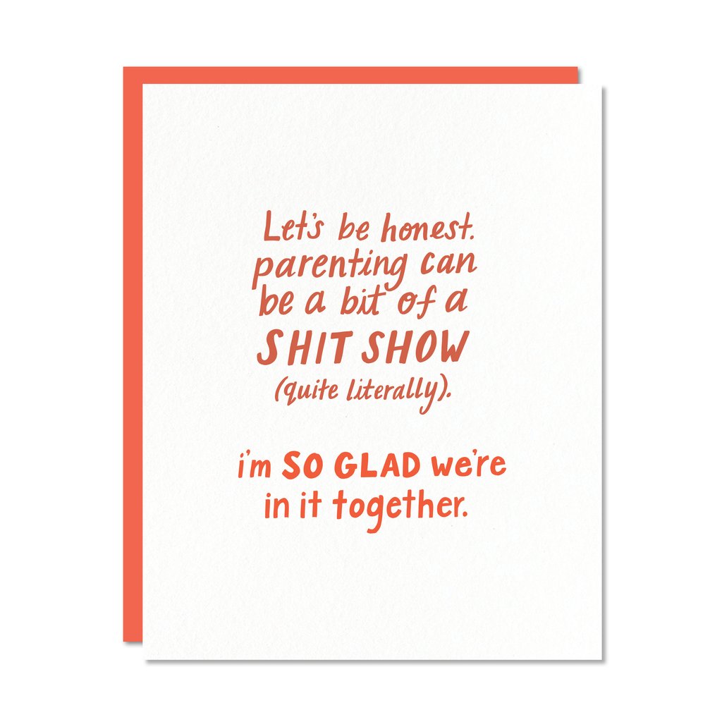 White card with red text saying, "Let's Be Honest. Parenting Can Be a Bit of a Shit Show (Quite Literally). I'm So Glad We're In It Together".  A red envelope is included.
