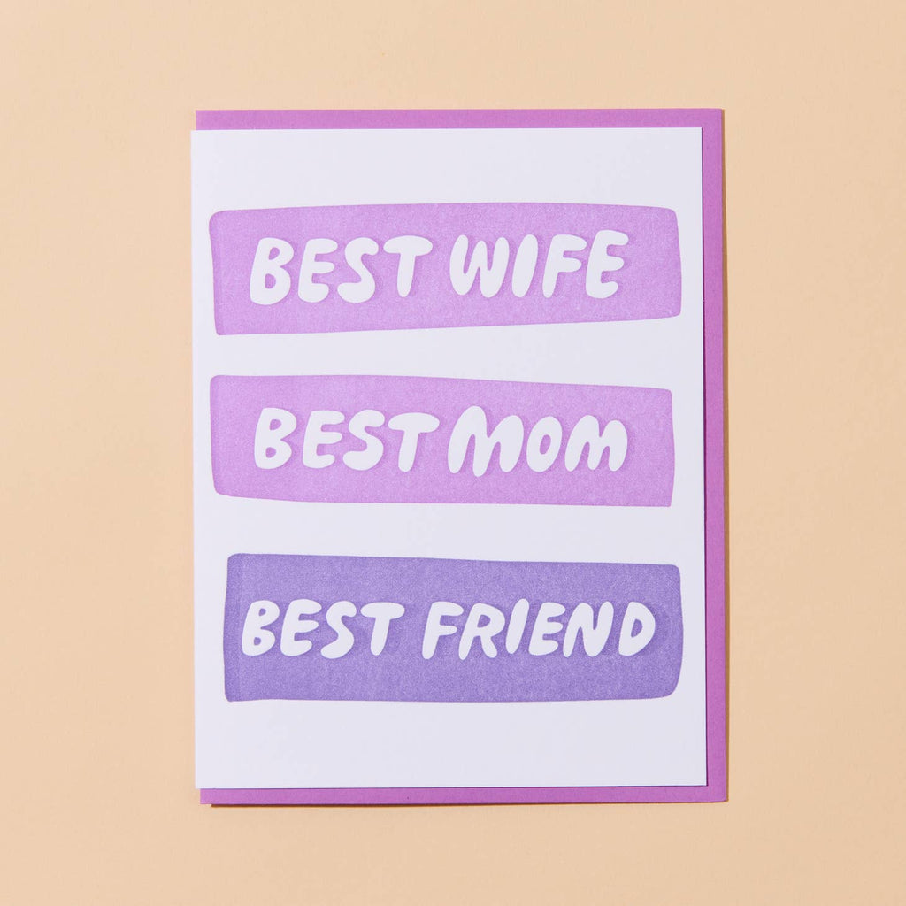 White card with three purple bubbles with white lettering in each saying “Best Wife” “Best Mom” “Best Friend”. Lavender envelope included. 