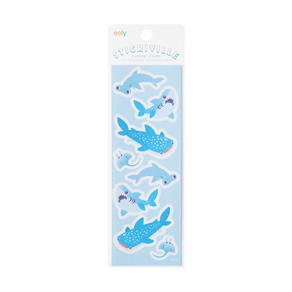 Image of sticker sheet with light blue background and images of sharks and sting rays