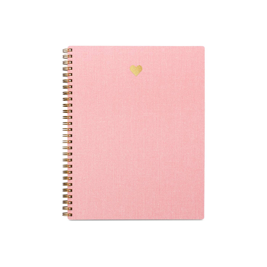 Pink background with small gold foil heart at top of notebook cover.