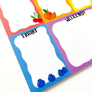 Image of notepad with seven blocks of color, one for each day of the week and one for notes with rainbow text says, "All the juicy details" and images of cherries, oranges, lemon, lime, blueberries, grapes and watermelon.