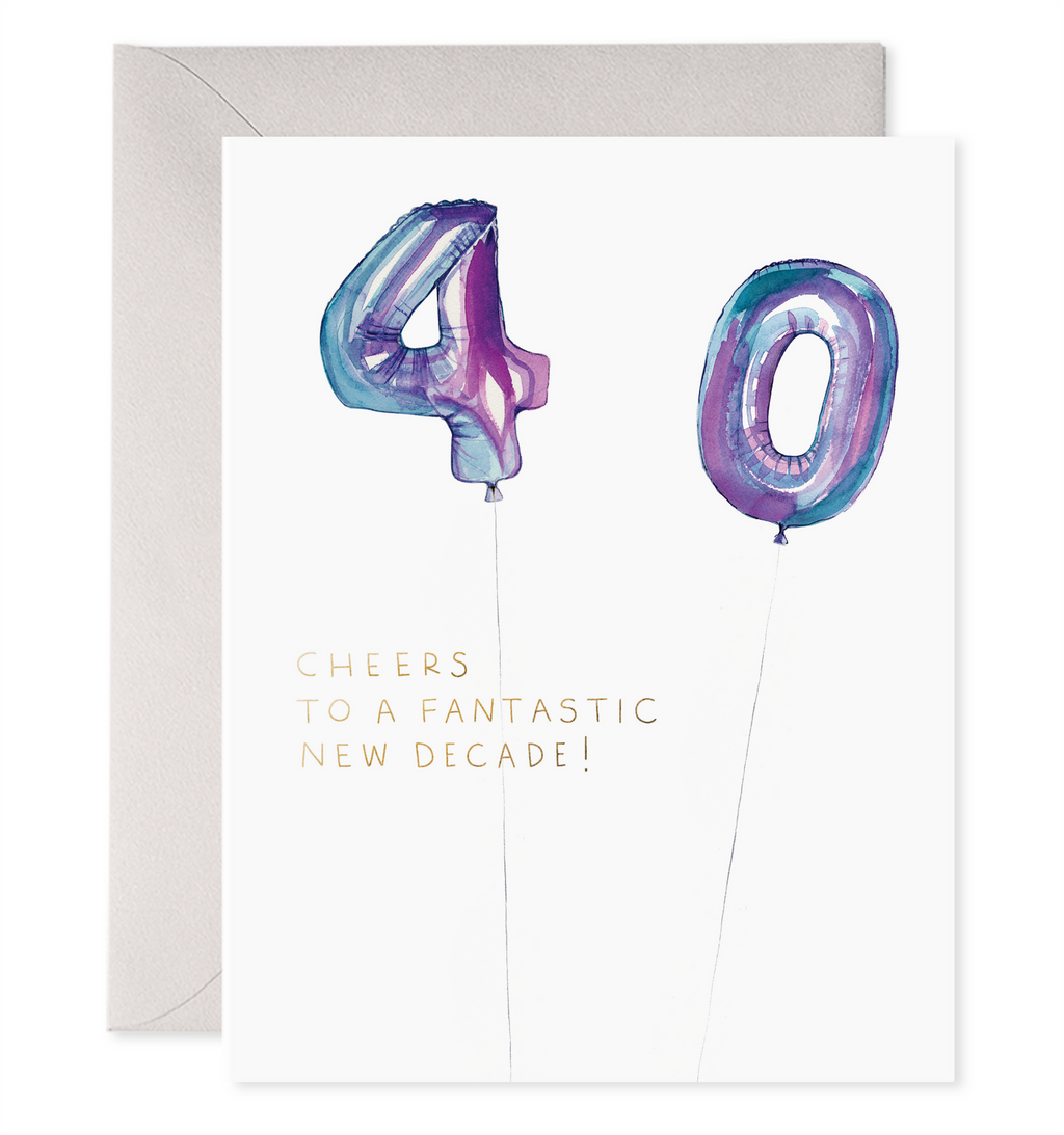 White card with black text saying, “Cheers to a Fantastic New Decade”. Images of purple foil balloons in the shape of a four and a zero. A grey envelope is included.