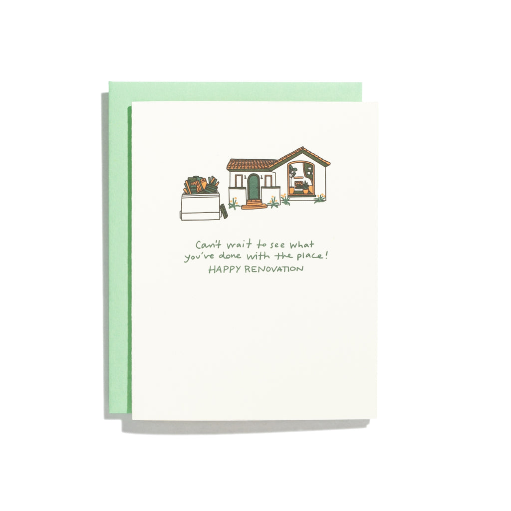 White card with green text saying, “Can’t Wait to See What You’ve Done with the Place! Happy Renovation”. Images of a house with a dumpster next to it filled with pieces of wood and rolled up carpets. A green envelope is included.