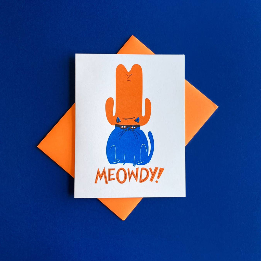 White background with image of a blue cat in an orange cowboy hat with orange text says, “Meowdy!”. Orange envelope is included.     