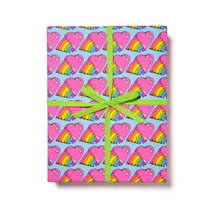 Gift wrap with light blue background and images of bright pink hearts with a rainbow emerging from one side.