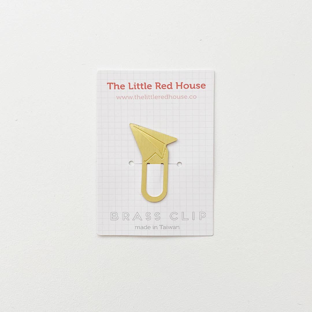Image of brass bookmark with paper airplane at top. 