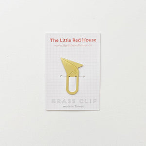 Image of brass bookmark with paper airplane at top. 
