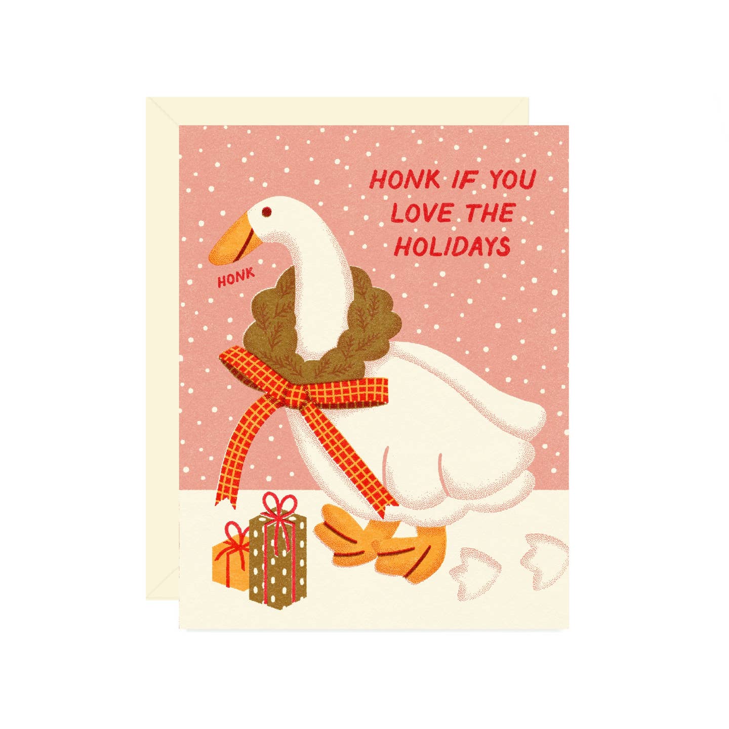 Greeting card with pink background and white snow with white goose wearing a holiday wreath with a red bow and red text says, "Honk if you love the holidays". Envelope included.