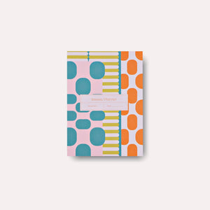 Planner cover with teal, chartreuse, orange and light blue geometric images. 