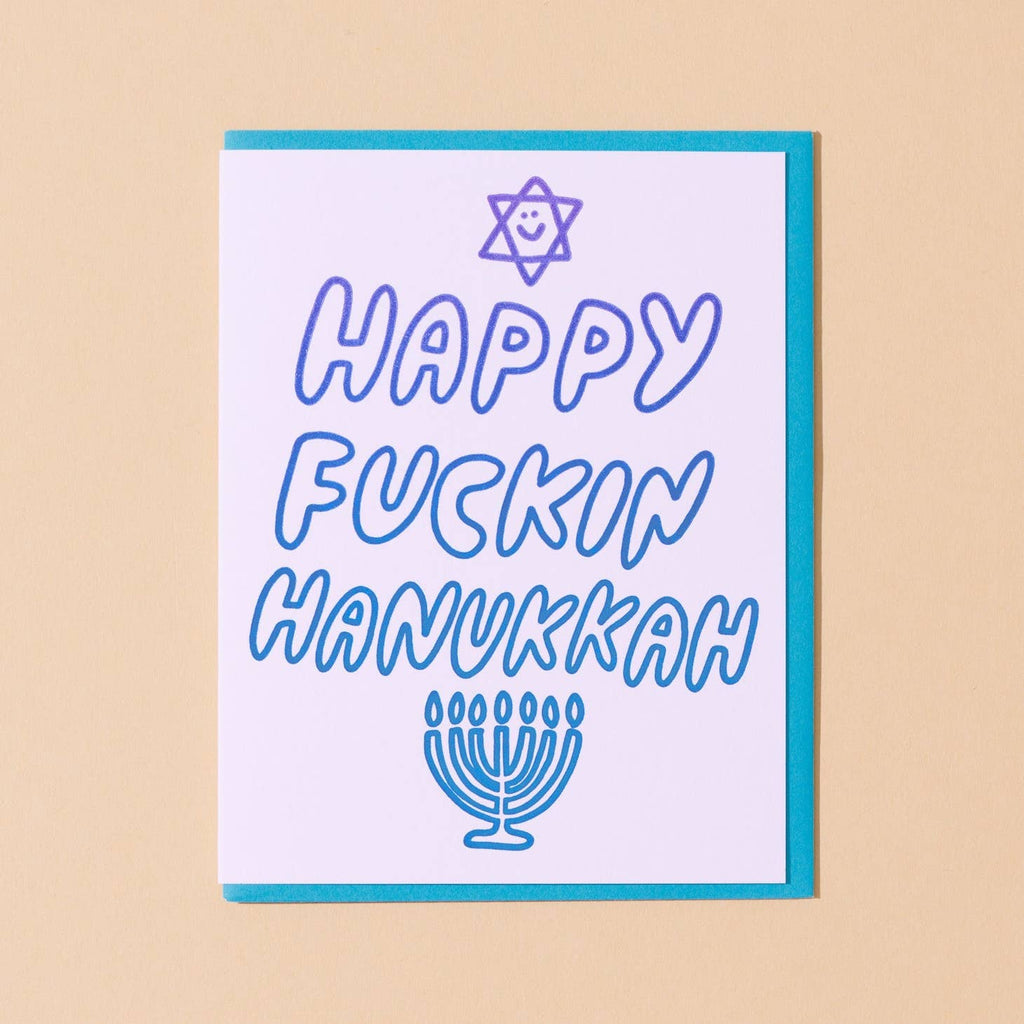 White background with blue puffy text says, "Happy Fuckin Hanukkah" with image of Star of David and menorah. Blue envelope included. 