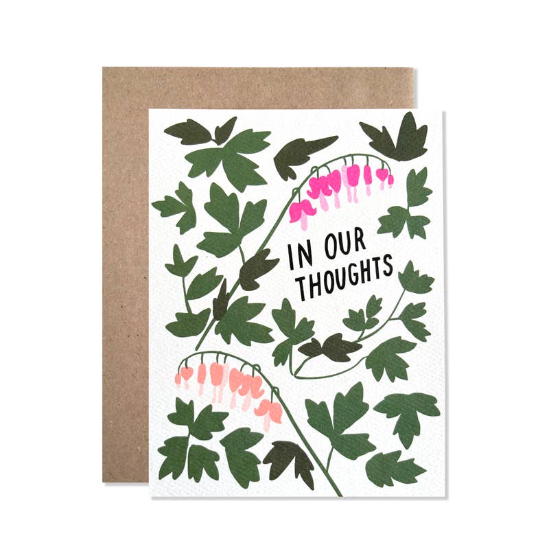 Greeting card with white background and images of bleeding heart flowers and green text says, "In our thoughts". Kraft envelope included. 