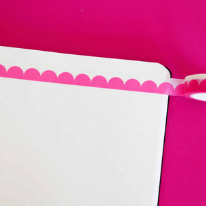 Washi tape with pink scallop design and white edging.