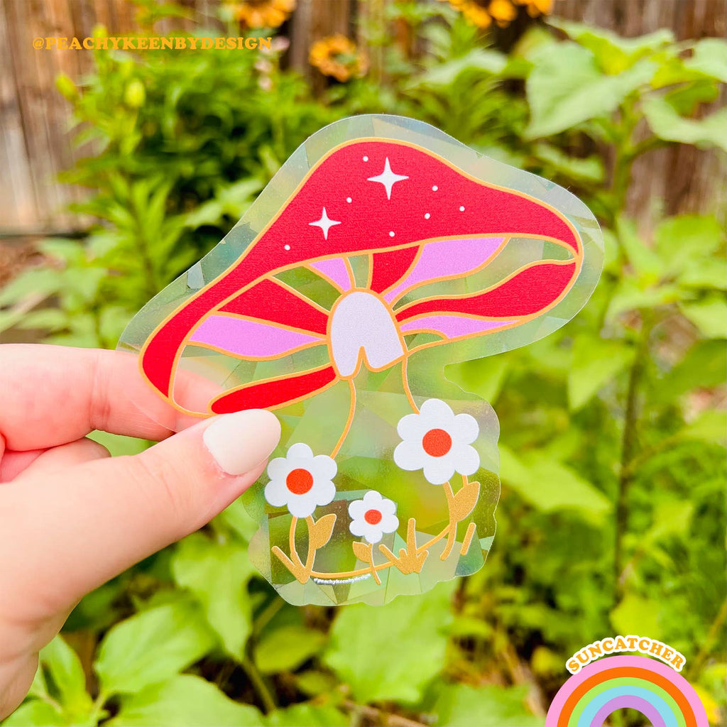 Image of suncatcher in the image of a mushroom in red, pink, yelow and white. 