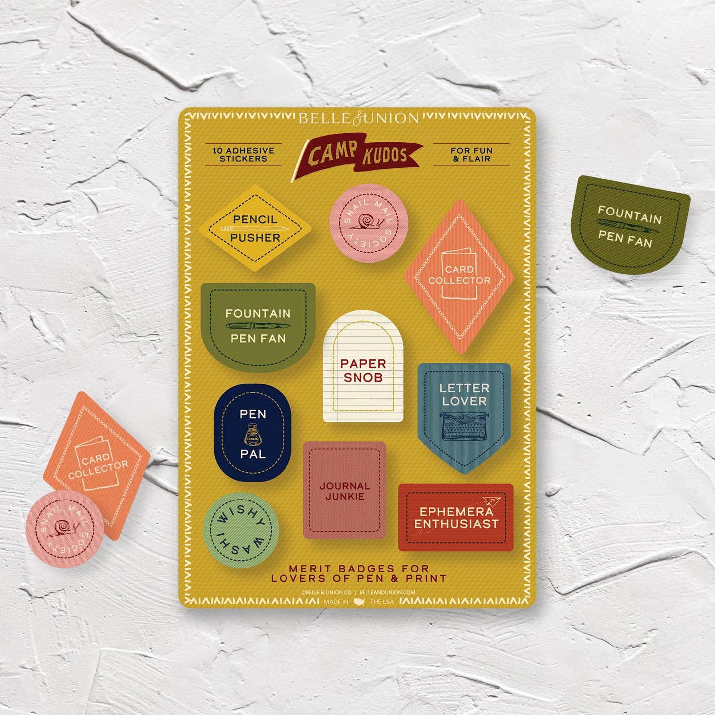 Sticker sheet with mustard background and stickers with stationery merits including, "Pencil pusher, paper snob, ephemera enthusiast, wishy washi". 