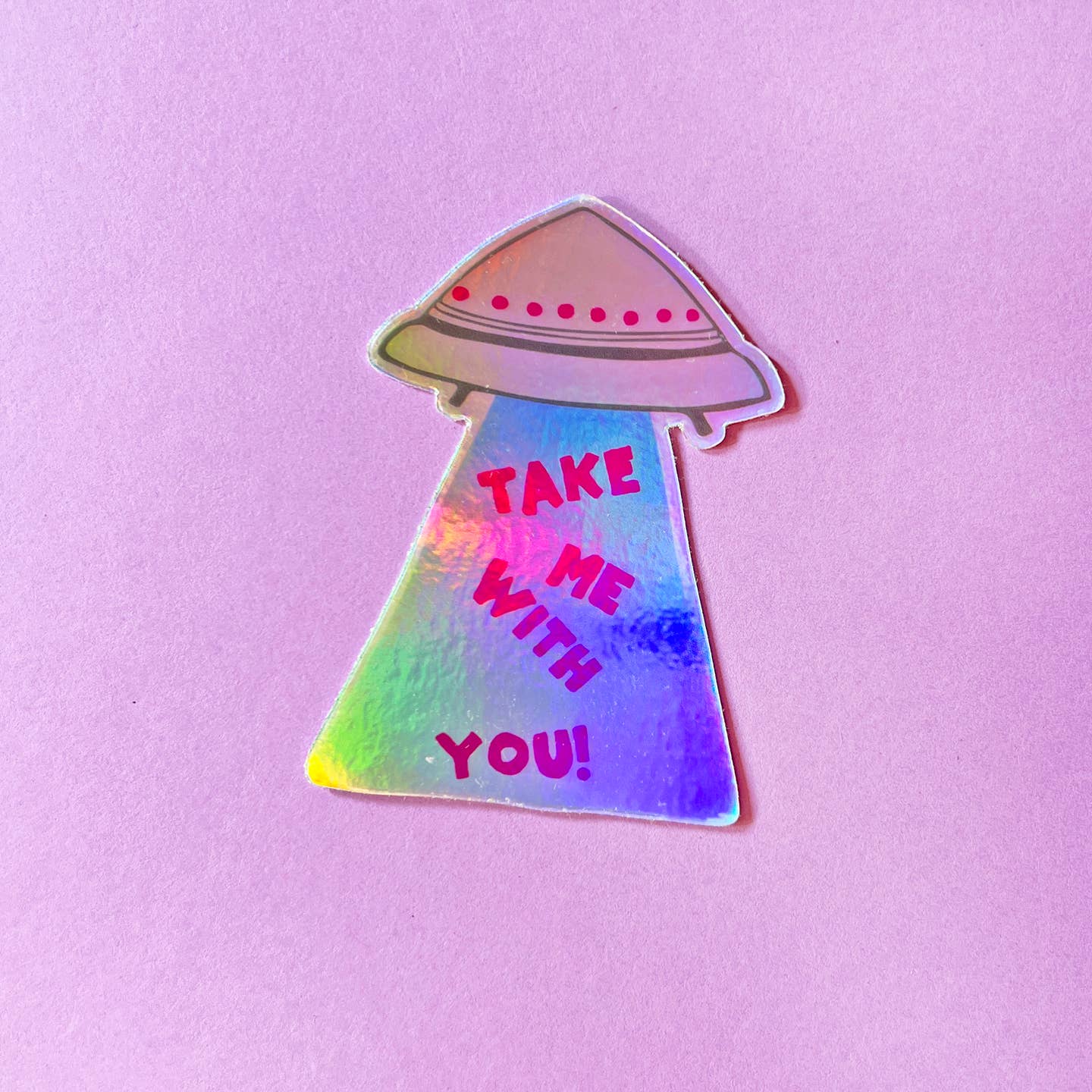 Image of a UFO spaceship with rainbow shaded beam from bottom with red text says, "Take me with you!