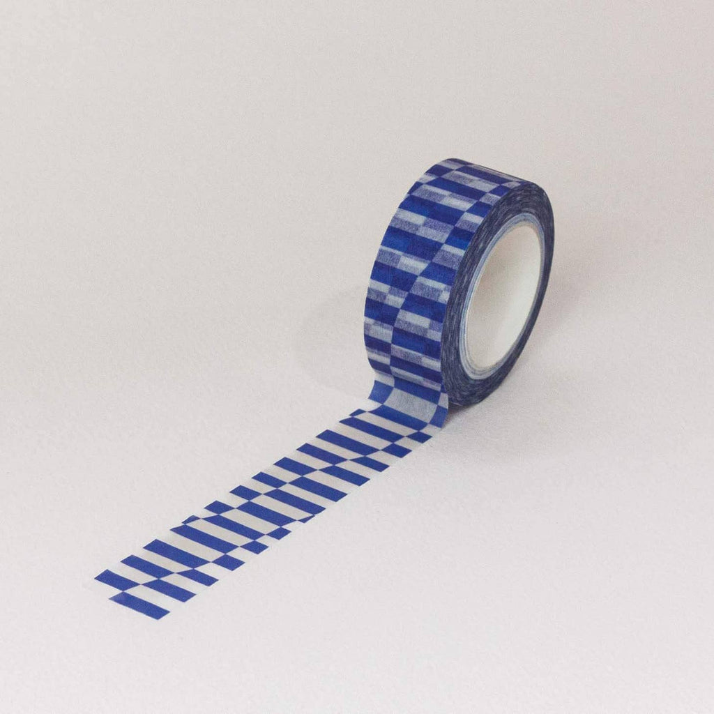 Blue and white leaning checkboard patterned tape. 