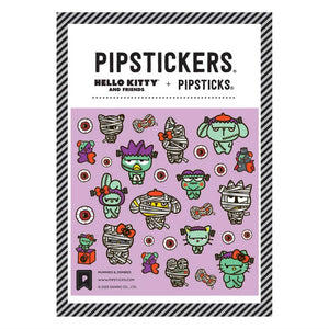 Image of sticker sheet with lavender background with images of  Hello Kitty characters dressed as mummies and zombies.  