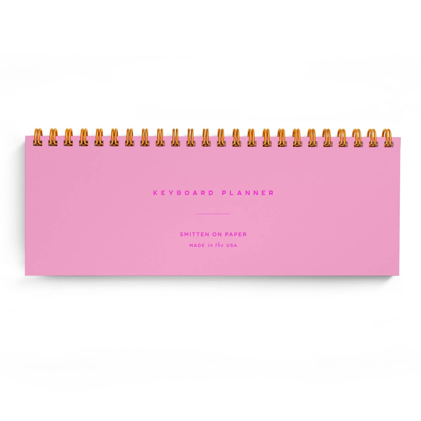 Planner with neon pink background and fuchsia text says, "Keyboard planner, Smitten on Paper, Made in the USA".  Gold coil binding on top. 