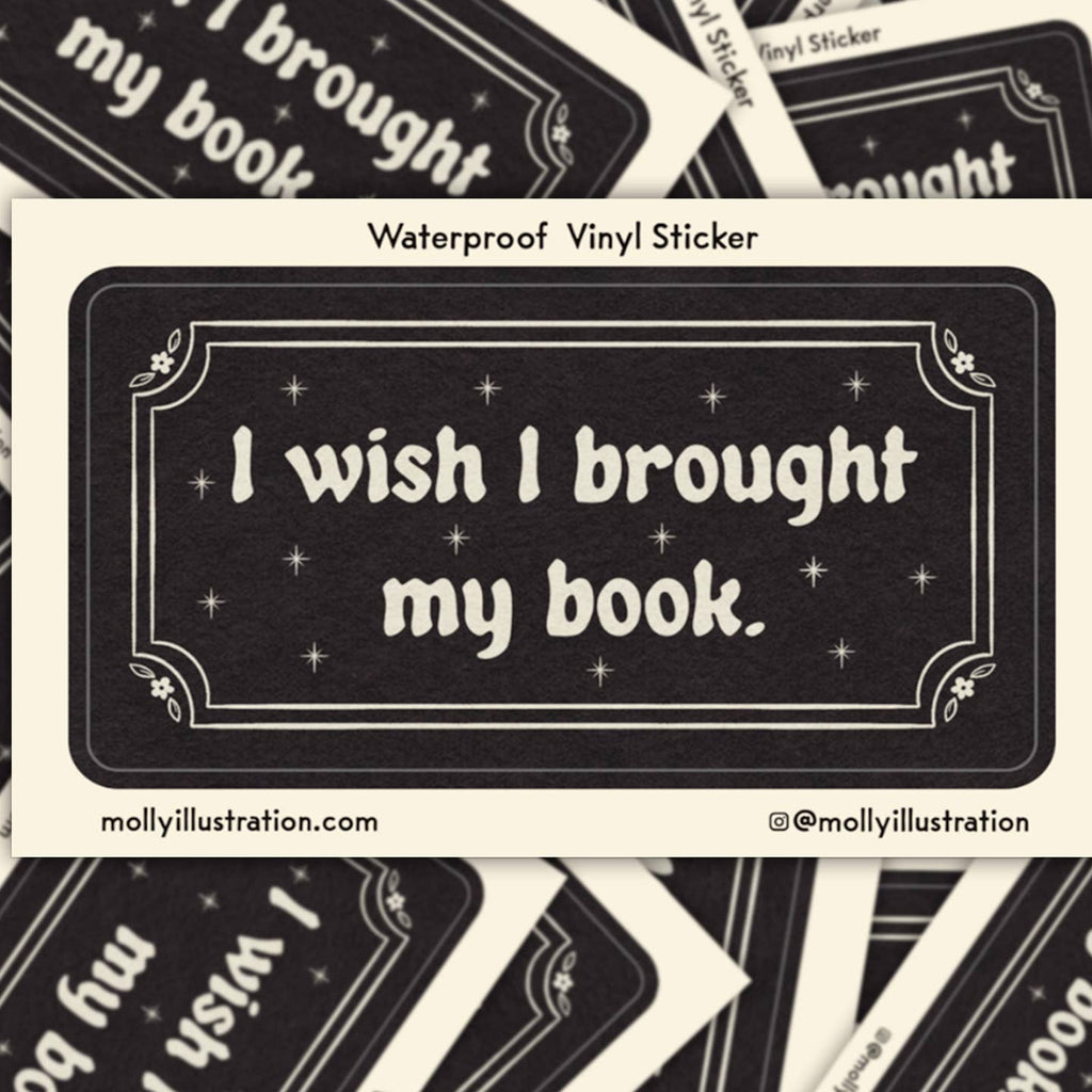 Decorative sticker with black background and white text says, "I wish I brought my book". 