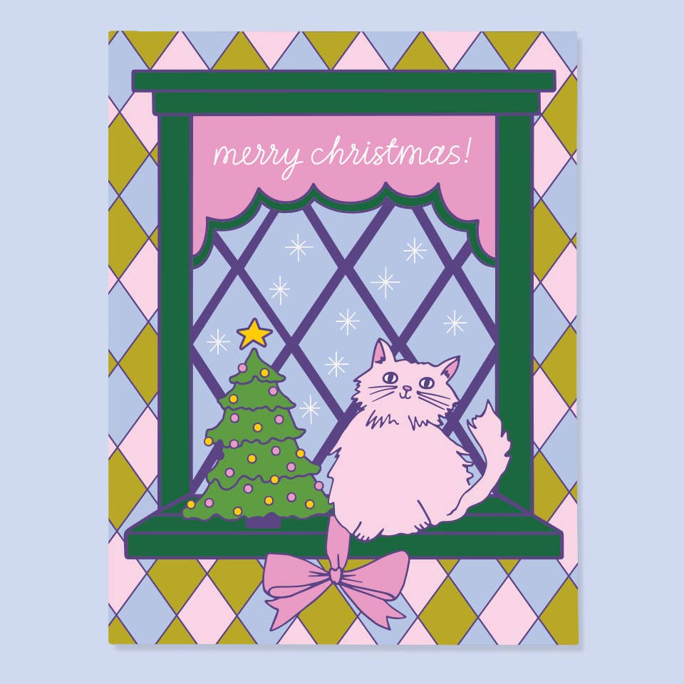 Greeting card with diamond pattern background and image of window with a cat and a Christmas tree in it. White text says, "Merry Christmas!". Envelope included. 