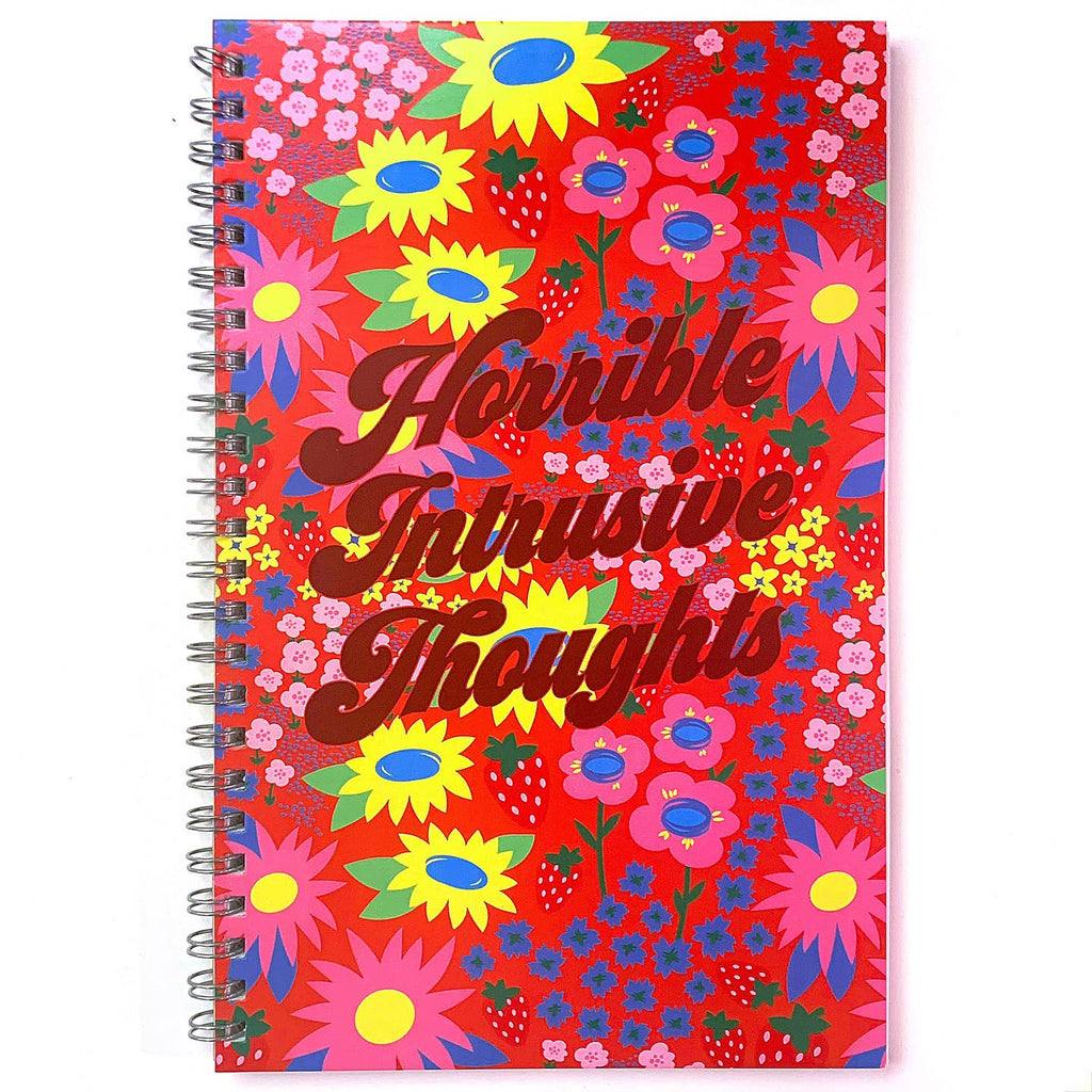 Notebook with red background and yellow, pink and blue flowers with red text says, "Horrible intrusive thoughts" with coil side binding.