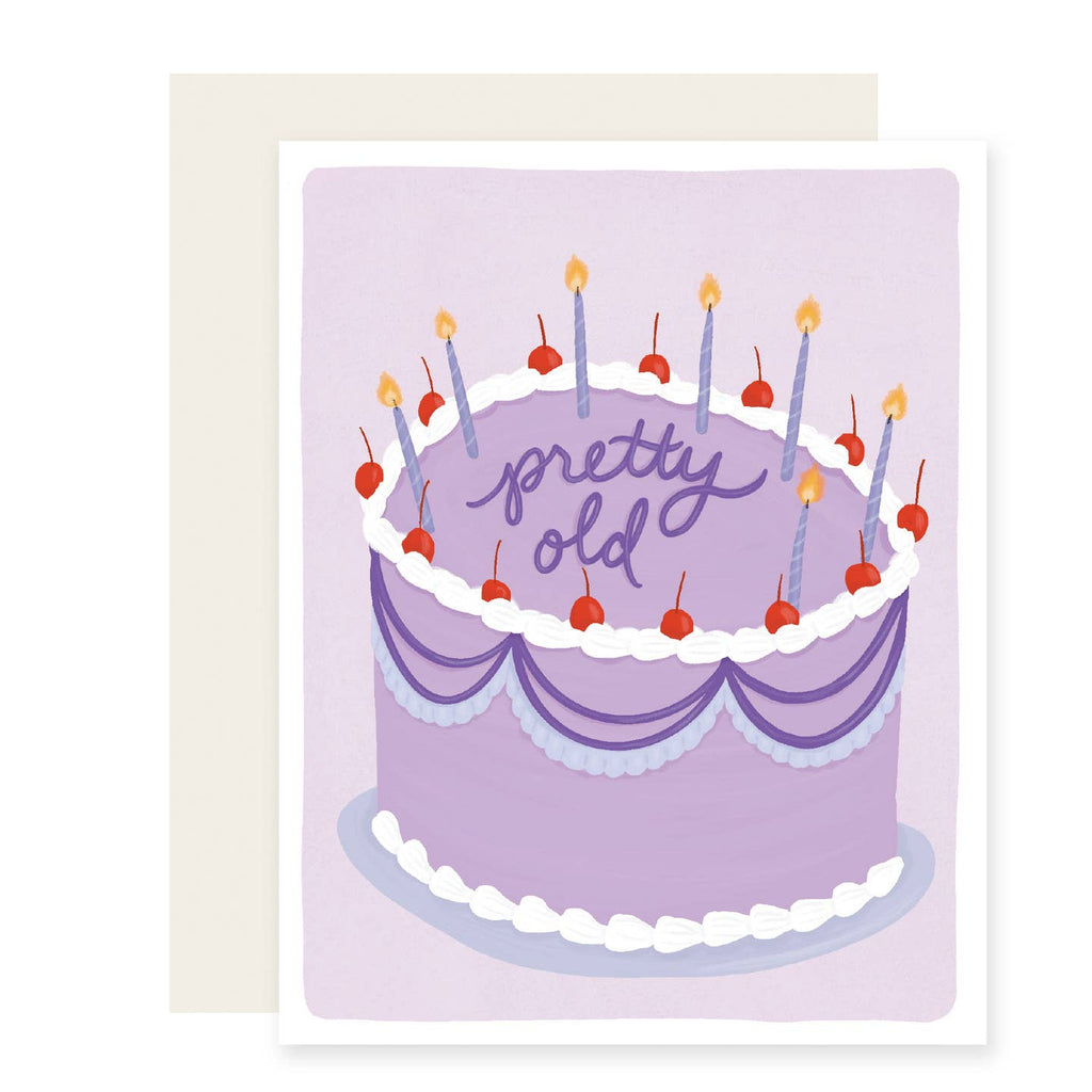 Greeting card with lavender background with image of a purple birthday cake with red cherries and candles. Envelope included. 