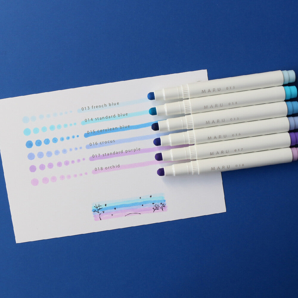 Image of highlighers with stripes and dots of colors on white page.