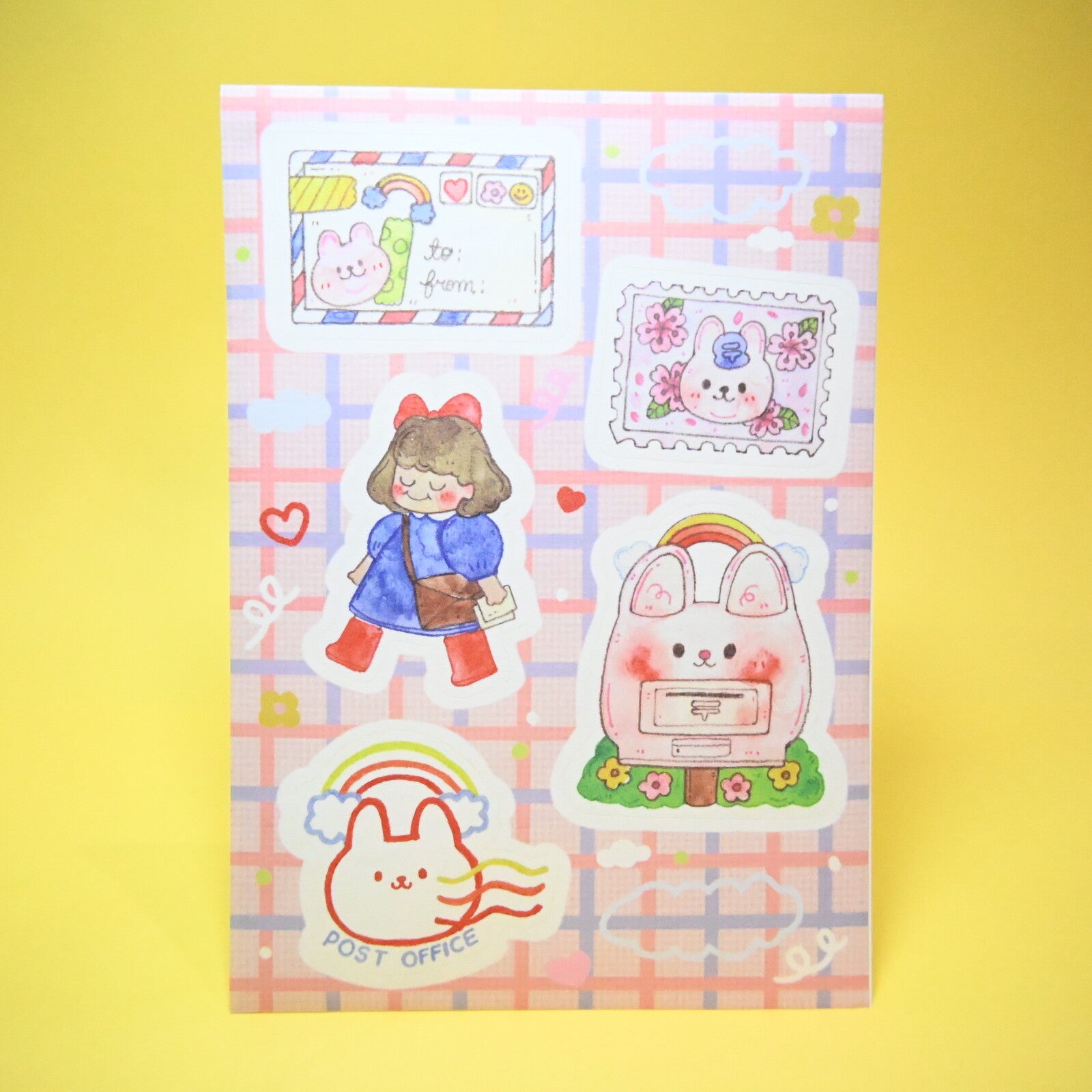 Sticker sheet with blue and pink background and images of postal workers and mail, envelopes.