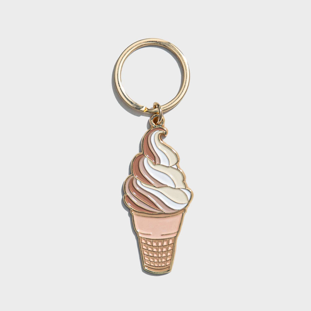 Image of a chocolate and vanilla swirled soft serve ice cream cone with a brass ring for keys.