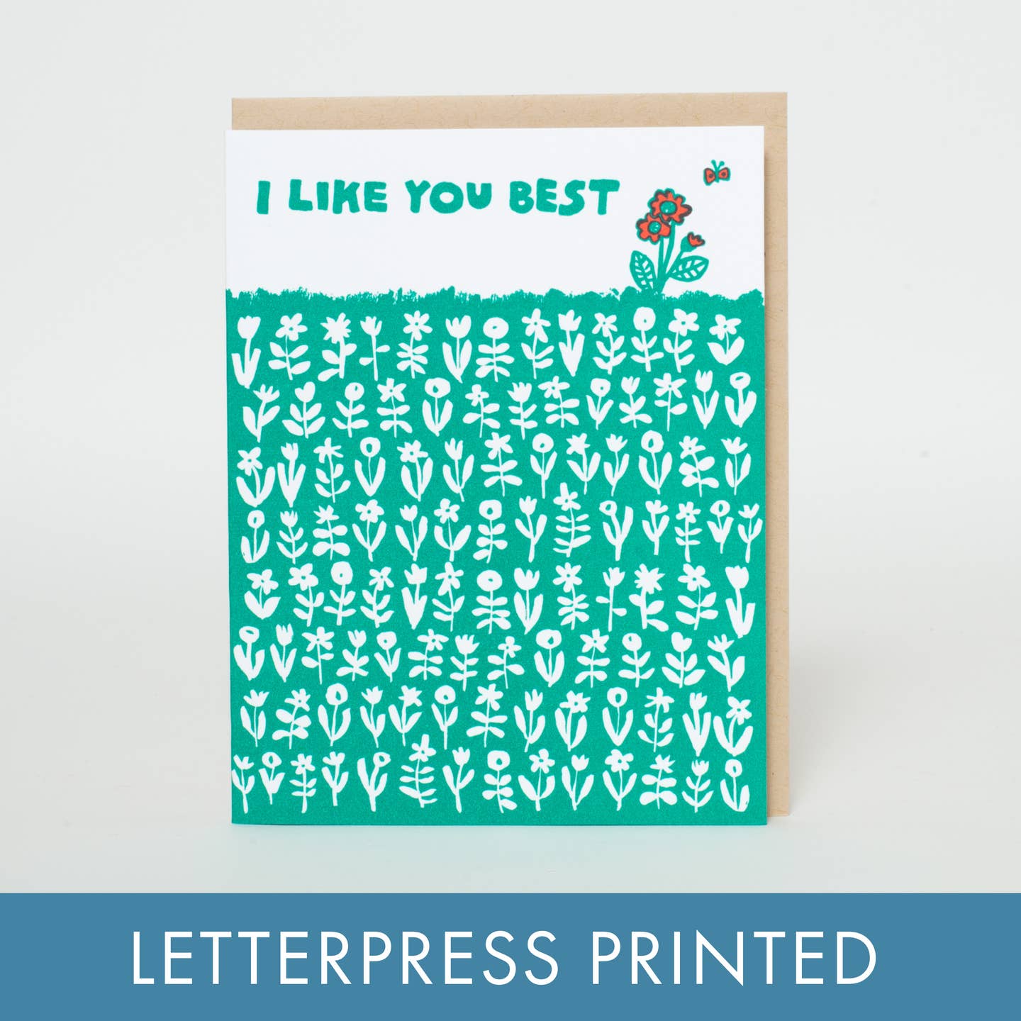 Greeting card with white and green background with images of white flowers and one red flower with green text says, "I like you best". Kraft envelope included. 