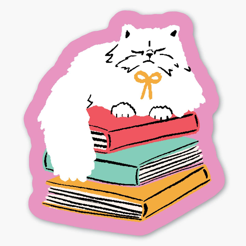 Sticker with pink background with image of a white cat with a yellow bow collar sitting on top a stack of books in red, mint and yellow. 