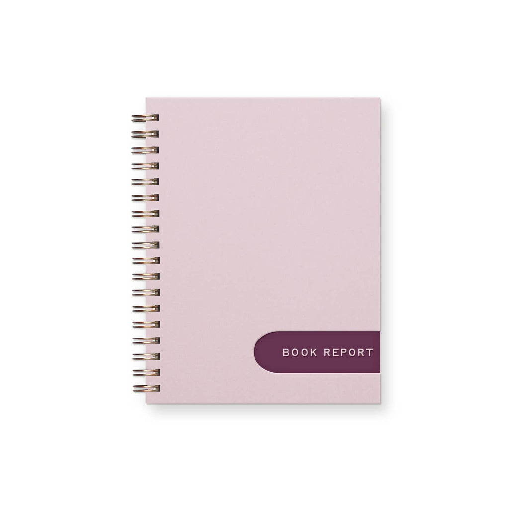 Notebook with pink cover and burgundy label near bottom with pink text says, "Book report". Coil binding.
