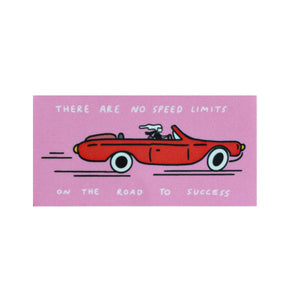 Decorative sticker with pink background and image of red sports car with white text says, "There are no speed limits on the road to success".