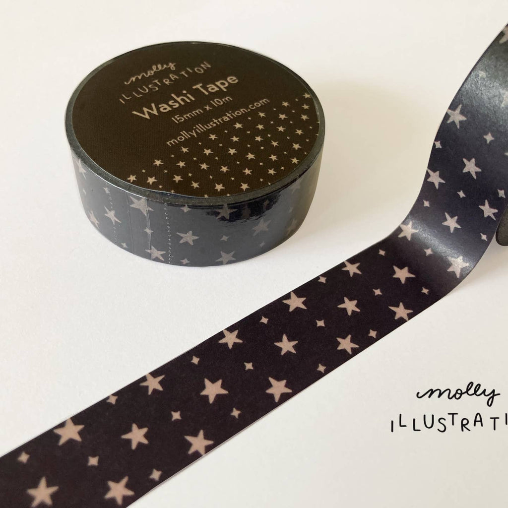 Decorative tape with black background and gold stars.