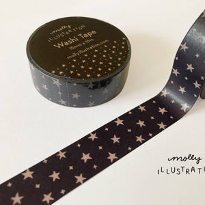 Decorative tape with black background and gold stars.